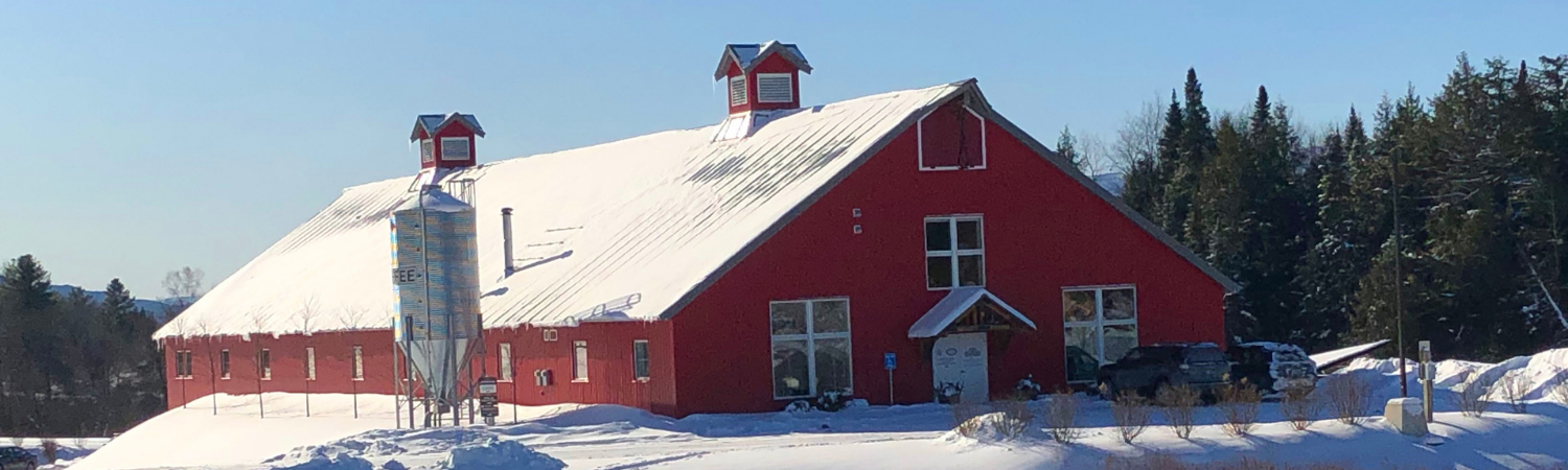Vermont Artisan Coffee Roasters building and coffee silo in the snow